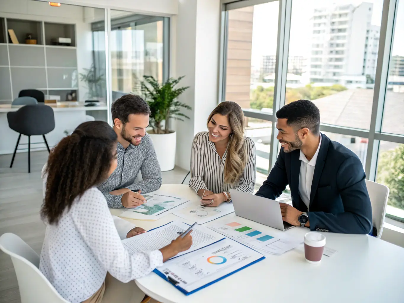 An image showing a team of professionals discussing real estate documents in a modern office setting, emphasizing collaboration and expertise.